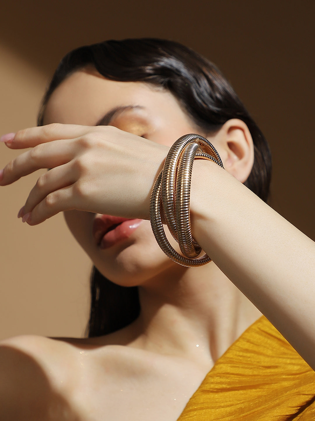 The Snake-Ribbed Bangle Bracelet - California Gold
